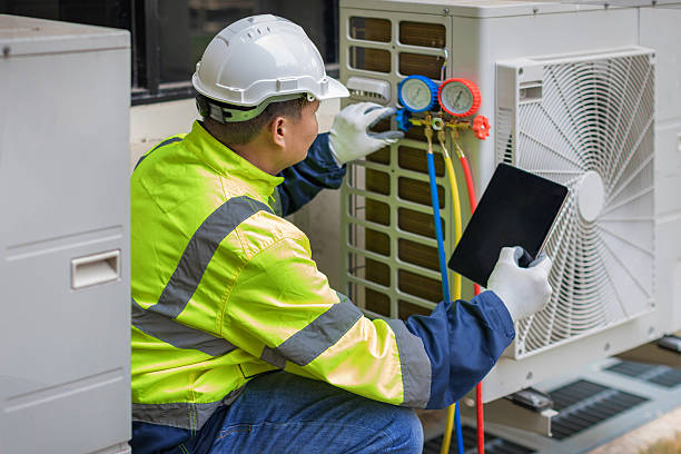 Professional Heat Pump Repair technician working in Bells, TX